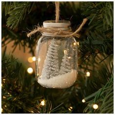 Dimensions: 2.63" H x 1.56" W x 1.56" D Material: Glass, Metal & Plastic Color: Clear, Silver & White Quantity: 1 Encapsulate the spirit of Christmas by displaying this Snowy Trees Jar Shaker Ornament! Made of glass, this lovely ornament contains two Christmas trees that are covered in glitter. Below the trees rests a bed of snow that can be moved with a gentle shake. Hang this piece up by its jute rope for a rustic, chic arrangement! Christmas Jars Decorations, Two Christmas Trees, Navidad Natural, Christmas Orniments, Christmas Units, The Spirit Of Christmas, Easy Christmas Ornaments, Fall Arts And Crafts, Bottle Brush Christmas Trees