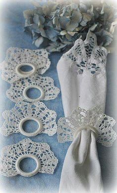 lace doily and napkins on a blue table cloth