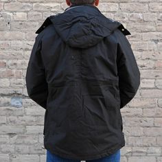 Expertly designed by Filson, the Ranger Insulated Field Jacket Root is made from midweight dry-waxed cotton for optimal durability and protection from the elements. Insulated with 100g PrimaLoft Gold, it also features a removable hood with 60g PrimaLoft Gold insulation. With high- and low-set hand pockets, expandable front cargo pockets, and a lined zip-close rear game pocket, this jacket offers ample storage for essentials.Additional Information: PLU: FIL-20263396 Brand: FILSON Urban Sport Coat With Double-lined Hood For Outdoor, Military Style Waterproof Parka For Fall, Weatherproof Parka For Outdoor Work In Fall, Weatherproof Cotton Windbreaker For Outdoor, Fall Parka With Fleece Lining For Outdoor Work, Black Cotton Sport Coat For Outdoor, Winter Utility Outerwear With Storm Flap, Outdoor Utility Jacket With Double-lined Hood, Classic Outerwear With Double-lined Hood For Outdoor