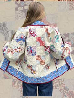 the back of a woman's jacket that has been made out of quilts