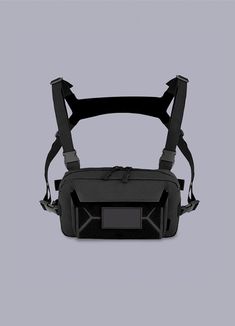 the back view of a black bag with straps on it and an electronic device attached to it