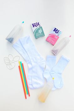 the contents of a diaper laid out on top of a white table with scissors, toothpaste, and other items