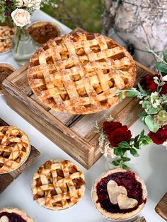 several pies and flowers on a table