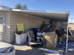 a house with junk piled up in front of it