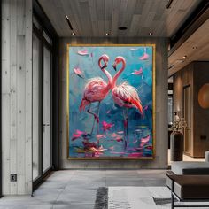 two pink flamingos standing in front of a large painting