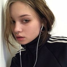 a girl with ear buds on her ears