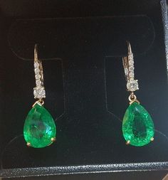 Gorgeous 14k white gold Colombian emerald earrings 11.03ct total weight natural excell treated green Colombian emerald in pear shape ,size 14x10 clean, nice cut,very brilliant side round diamonds 0.52 Carat total weight Diamond Earrings SI1-H A gorgeous pair of earrings! very nice make ,beautiful setting , 1.5 inch long Appraisal available Retail value $12,500 net Snow Earrings, Emerald Earrings Drop, Colombian Emeralds, Drop Dangle Earrings, Emerald Earrings, White Gold Engagement Rings, Diamond Drops, Green Emerald, Emerald Diamond