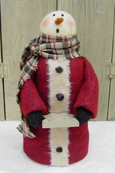 a snowman with a red coat and scarf