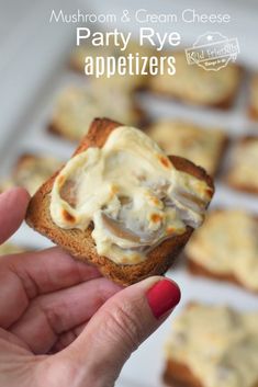 a hand holding a piece of bread with cream cheese on it and the words, mushroom & cream cheese appetizers