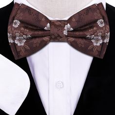 Brown Original Floral Bow Tie A simple yet elegant brown floral bow tie is all that is needed to transform your look into the perfect looking outfit for any occasion. Choose From: Single Bow Tie Bow Tie and Pocket Square Type Of Bow Tie: Self-Tie Pre-Tied Material of Bow Tie and Pocket Square: 100% Silk Bow Tie Fits Neck Sizes: 14 - 22” Inches Pattern On Fabric: Floral Color Of Fabric: Brown, White Types Of Bows, Tie Bow Tie, Floral Bow Tie, Silk Bow Ties, Bow Tie Set, Silk Bow, Tie Bow, Fabric Floral, Floral Color