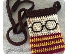 a crocheted bag with glasses on it