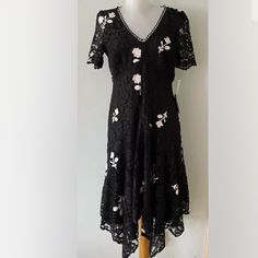 Size : 4 Petite Color : Black And Ivory Bust : 36” From Underarm To Underarm, Lay Flat Length : 44” From Back Neck Line To The Longest Part Of Hem. Back Zipper. Black Short Sleeve Lace Dress For Spring, Black Lace Dress With Short Sleeves For Spring, Black Midi Dress With Floral Embroidery And Short Sleeves, Lace High Low Dress, Dress With Floral Embroidery, Taylor Dress, Floral Embroidery, Lay Flat, Black Lace