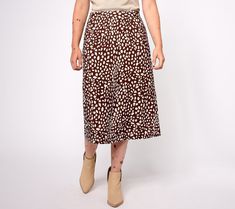 Get in on the midi skirt moment with this playfully printed style. Surprisingly versatile, the stretchy knit pairs fantastically with sneakers and a tee for daytime, boots and a blouse for the office, or heels and a moto jacket for evenings out. From AnyBody®. Black Skater Skirts, Color Block Skirt, Snood Scarf, Skirt Trends, Petite Skirt, Black Leather Skirts, Printed Midi Skirt, Body Con Skirt, Summer Skirts