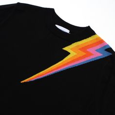 a black t - shirt with a rainbow lightning bolt on it