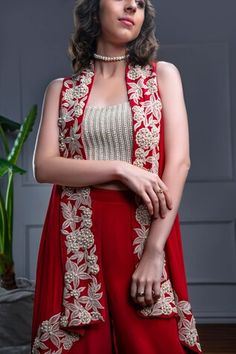 Red sleeveless asymmetric jacket with phoolista dori-pearl embroidery. Paired with a pearl encrusted crop top and a flared pant. - Aza Fashions Red Sleeveless Sets For Festive Occasions, Pearl Embroidery, Asymmetric Jacket, Women Kurta, Open Neck, Luxury Sale, Embroidered Jacket, Jacket Pattern, Set Women