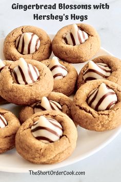 a white plate topped with cookies covered in frosting