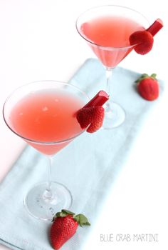 strawberry rhubar cosmopolata in martini glasses with strawberries on the rim