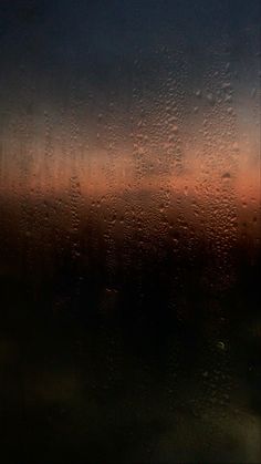 rain drops on the window at sunset