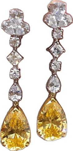 Pear-shaped Diamond Earrings For Evening, Formal Yellow Earrings With 17 Jewels, Yellow Earrings With 17 Jewels For Formal Occasions, Luxury Yellow Teardrop Earrings, Elegant Yellow Diamond Cut Earrings, Elegant Yellow Diamond-cut Earrings, Elegant Yellow Pear-shaped Earrings, Elegant Pear-shaped Yellow Earrings, Elegant Yellow Teardrop Dangle Earrings