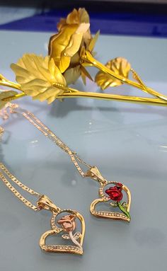 "Special for you. We offer free shipping with the purchase of 35 dollars or more! with First Class Mail (Not Priority Mail) 14k Gold Plated Rose Flower & Heart Necklace ~ Rosa y corazon Dije + Cadena ~ Gold Plated Rose Flower Jewelry. Rose Flower & Heart Necklace. Special Mother's Day, Valentine's Day, Easter, Christmas, or any holiday! Gorgeous Rose Pendant + Chain *14k Gold Plated *Includes 18,20,22,24 inches velentine chain Material: Copper Measurements: Chain - 11.5 inch. from top to Beauty And The Beast Wedding Dresses, Save Relationship, Flowers Jewelry, Rose Heart, Wrist Jewelry, Hippie Style Clothing, Rosé Heart, Rose Pendant, Rose Necklace