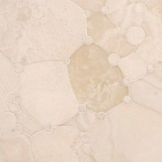 an abstract marble background with circles and bubbles in white, beige and grey colors on the surface