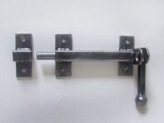 an image of two metal handles on the wall