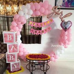 a baby shower with balloons and decorations