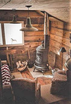 a living room filled with furniture and a wood stove