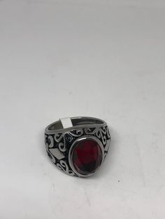 Vintage Red Ruby Glass Mens Ring Stainless Steel Deco design about half an inch Cool Vintage Rock and Roll star men's ring Nice heavy ring, Stainless Steel Unused stock from the 1980's I have an assortment of sizes from 7 - 9 - 10 - 11 - 12 or 13 ONLY. Please add your size to the order in a message and I will send the size you require. If I am out of stock in your size, I will list the ones I have available for replacement. If I am sold out in the sizes you would prefer, I will cancel and refund Retro Red Ring Jewelry, Mens Stainless Steel Rings, Vintage Gothic, Vintage Rock, Mens Ring, White Band, Ring Photos, Men's Ring, Red Ruby