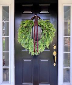 a wreath on the front door of a house