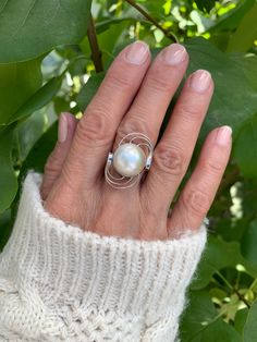 Natural white mabe pearl ring with round swirls on both sides. Sterling Silver 925 . Unique design. Pearl diameter 1.3cm Unique Oval White Pearl Ring, Unique White Oval Pearl Ring, White Oval Pearl Ring, Unique White Pearl Ring, White Pearl Ring, Mabe Pearl, June Birthstone, June Birth Stone, Pearl Ring