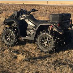 an atv parked in the middle of a field