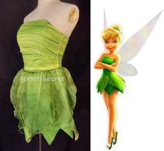 the tinkerbell fairy costume is on display next to a mannequin's head