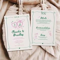 two wedding cards sitting on top of a bed next to a roped bag and pillow