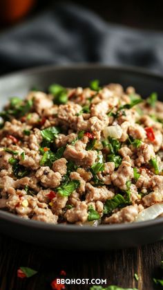 a close up of a plate of food with meat and vegetables on the side,