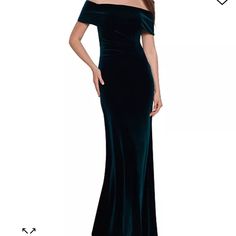 a woman in a long velvet dress with off the shoulder sleeves and an open back