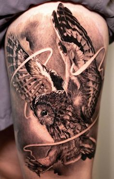 an owl and bird tattoo on the thigh