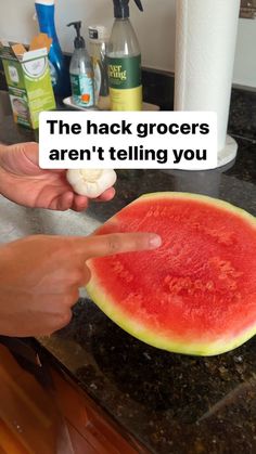 a person pointing at a piece of watermelon on a counter with the caption'the hack grocers aren't telling you