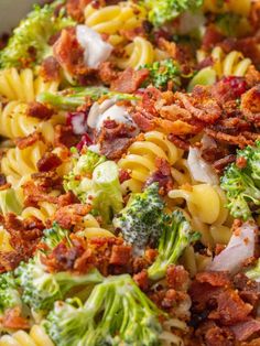 pasta with bacon, broccoli and onions in a bowl