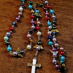 Rosary Necklaces For Healing. Beautiful Colors The Cross And Mary Is On This One. New Still In Bag. Never Been Used. Diy Rosary Necklace, Rosary Ideas, Diy Rosary, Rosary Necklaces, Lisa Frankenstein, Dainty Bar Necklace, Lariat Necklace Silver, Sunflower Necklace, Toggle Necklace