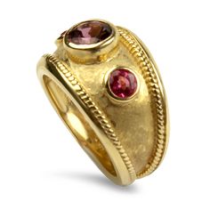 This exquisite 14K yellow gold ring features a stunning center round pink tourmaline, measuring 6.5mm and weighing approximately 1ct, elegantly bezel set. Flanking the tourmaline are two round 4mm pink spinel with an estimated total weight of .56cts, also bezel set for a cohesive look. The ring showcases a unique satin hammered finish, bordered by intricate rope detailing and highly polished edges. Measuring 13mm at its widest point and tapering to 3mm at the base of the shank, this size 6 ring is stamped "14K" for authenticity. A perfect choice for those seeking a vibrant, sophisticated statement piece.Replacement Value: $2,575.00 Formal Tourmaline Ring With Bezel Setting, Formal Tourmaline Rings With Bezel Setting, Elegant Pink Sapphire Ring With Bezel Setting, Elegant Pink Tourmaline Birthstone Ring, Ruby Ring With Tourmaline And Gemstone Accents, Elegant Tourmaline Birthstone Ring With Bezel Setting, Elegant Yellow Gold Tourmaline Birthstone Ring, Yellow Gold Ruby Ring With Tourmaline Center Stone, Formal Pink Rings With Bezel Setting