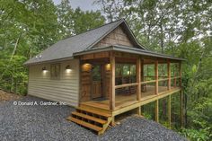 a small cabin in the woods with stairs leading up to it's porch and deck