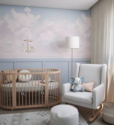 a baby's room with a crib and rocking chair