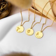 Our Personalized Birthflower Necklace is the perfect blend of elegance and sentiment. Each delicate pendant showcases a birthflower, representing the month of birth, and can be customized with a name or date. Ideal for birthdays or any special occasion, this necklace is a thoughtful and meaningful gift. Its dainty design adds a sophisticated touch to any look, making it a cherished addition to any jewelry collection. - Material: High Quality Solid 925 Sterling Silver - Dimensions: 12 mm - Finish: 14k Gold, 14k Rose Gold, 14k White Gold - Each piece of our jewelry is unique and lovingly handcrafted for you only ♡ HOW ∙ TO ∙ ORDER - Select chain length. - Select your preferred finish. - Use the 'PERSONALIZATION BOX' to tell us your preferred NAME, FONT NUMBER and BIRTHFLOWER. ✦ Birthflower + Anniversary Birth Flower Charm Necklaces, Anniversary Flower Charm Necklace With Birth Flower, Anniversary Flower Necklace With Birth Flower In Round Shape, Flower-shaped Birth Flower Charm Necklace For Anniversary, Nature-inspired Birth Flower Necklace For Anniversary, Birthday Charm Necklace With Birth Flower, Birth Flower Pendant Necklace As Gift For Mom, Birth Flower Round Pendant Necklace For Mom, Botanical Birth Flower Necklaces For Mother's Day