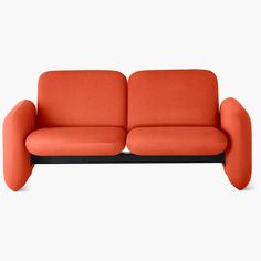 an orange couch with black legs on a white background