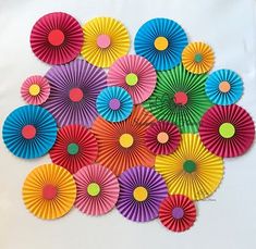 colorful paper fans laid out on top of each other