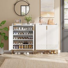 a white cabinet with shoes on it in front of a mirror and potted plant