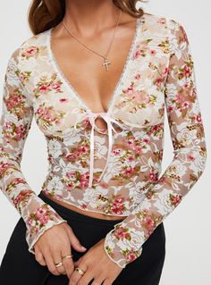 Long sleeve floral lace top V-neckline, ribbon detail, flared cuff Good stretch, lined bust 93% nylon 7% elastane Cold gentle machine wash Festival Tops Women, Womens Going Out Tops, Floral Lace Top, Womens Knit Tops, Floral Lace Tops, Fleece Dress, Outerwear Outfit, Going Out Tops, Online Fashion Boutique