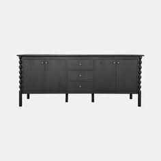 the sideboard is made from dark wood and has gold knobs on the drawers