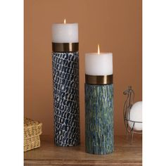 two candles sitting next to each other on a table